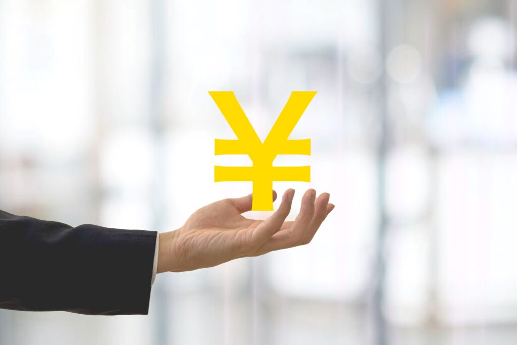 お金マークとビジネスマンの手