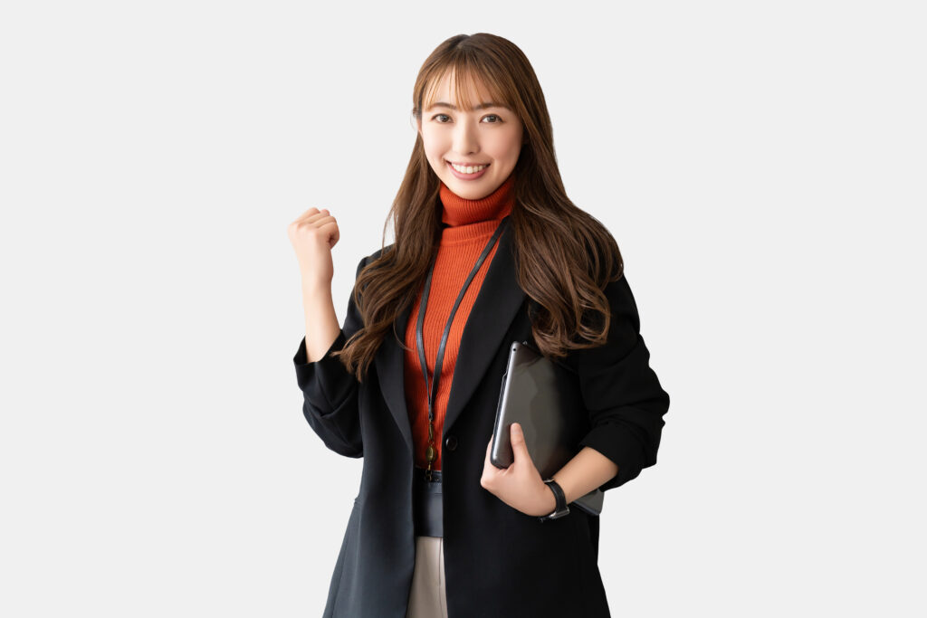 ガッツポーズをする女性