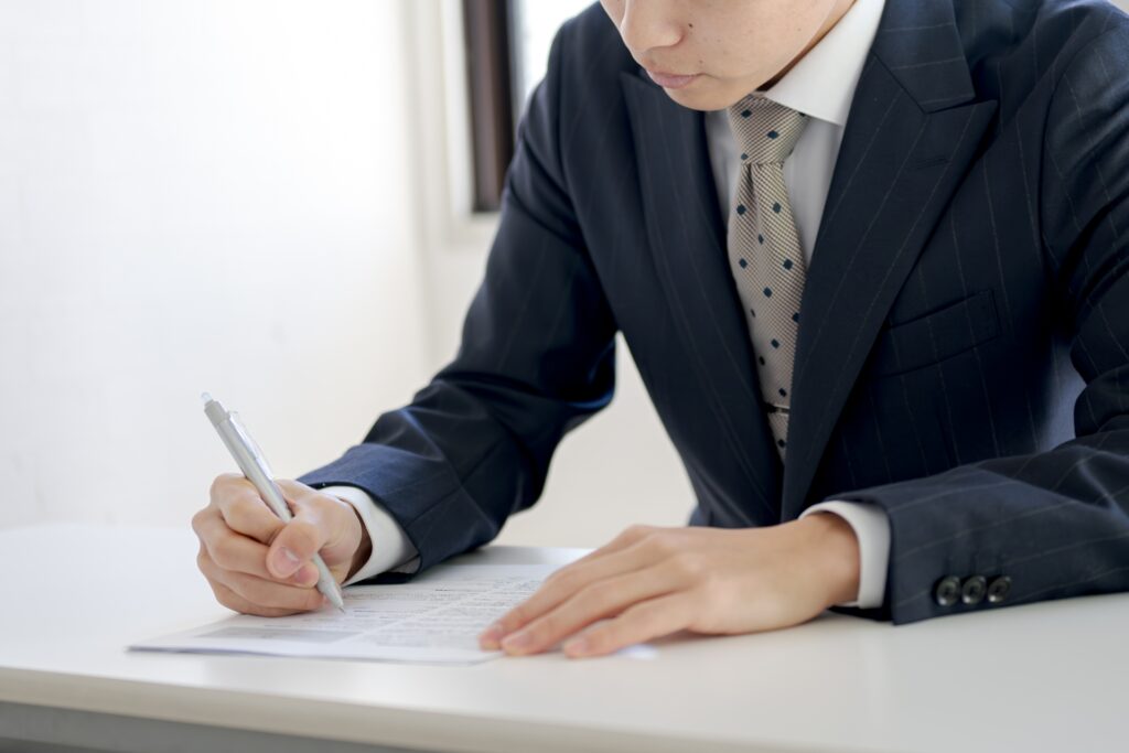 ペンとビジネスマン 顔無し