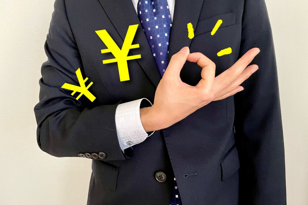 お金のジェスチャーをするビジネスマン