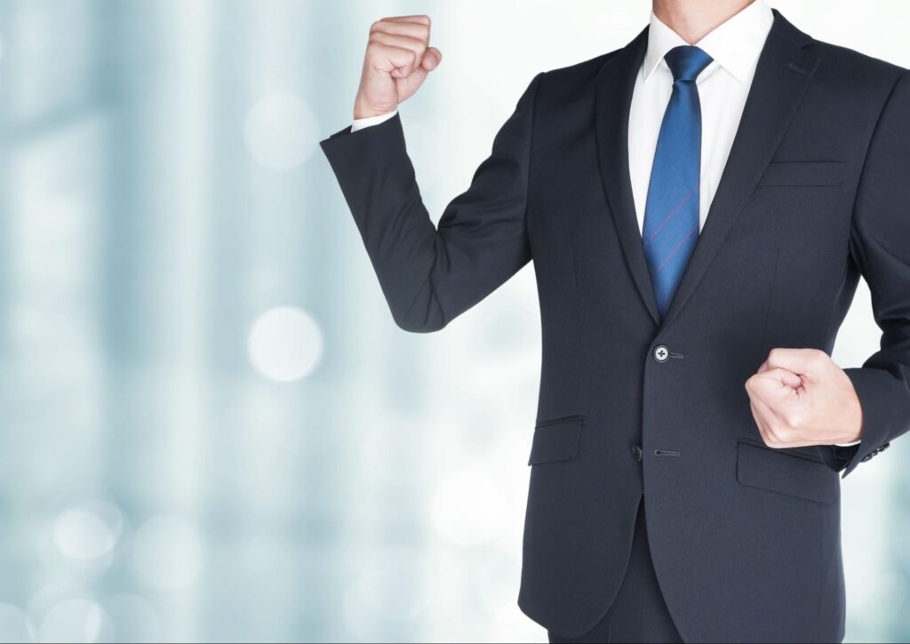 ビジネスマンのガッツポーズ
