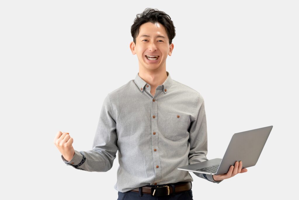 ガッツポーズをする笑顔の男性ビジネスマン